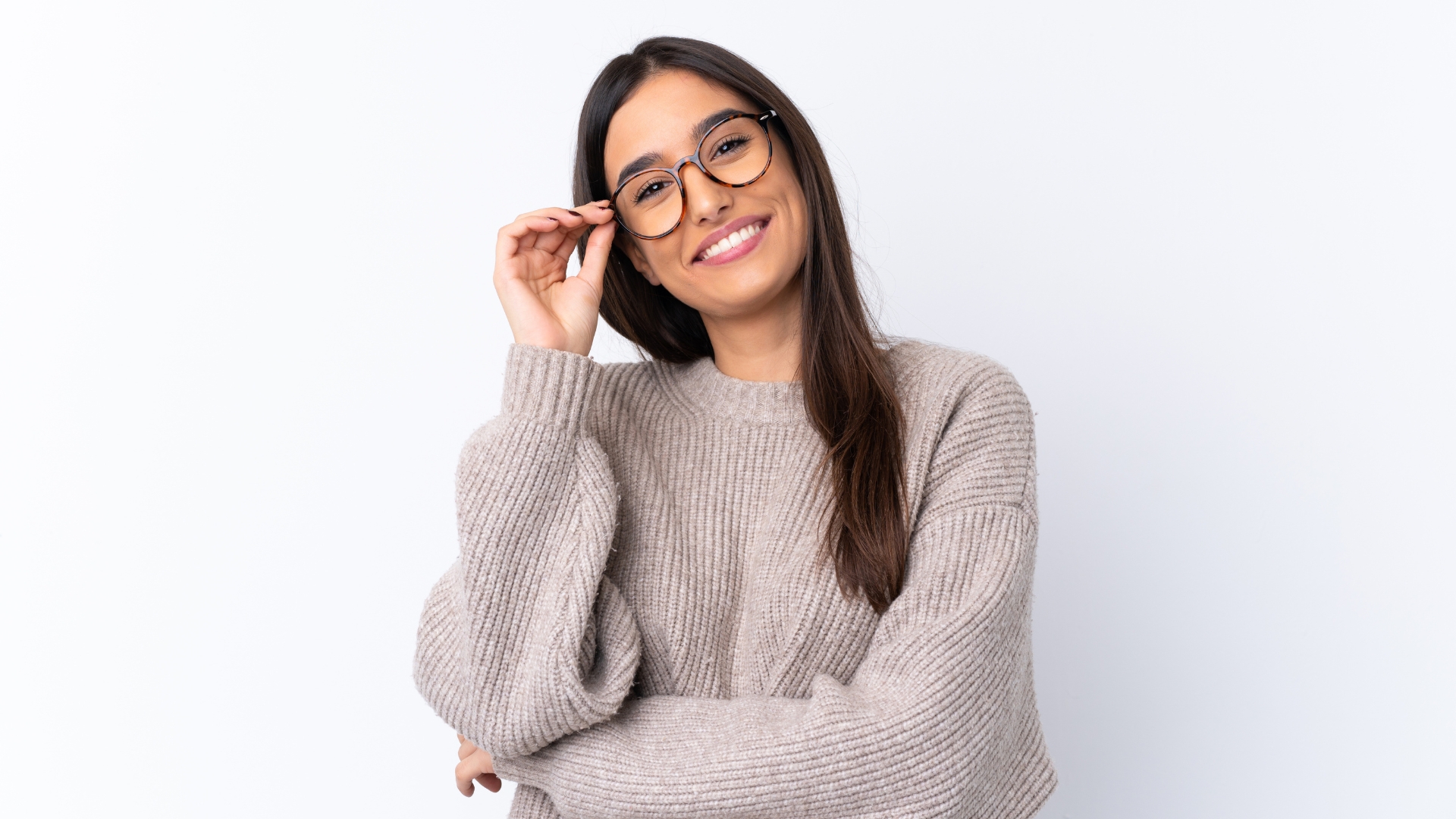 Woman smiling while wearing stylish new eyeglasses.