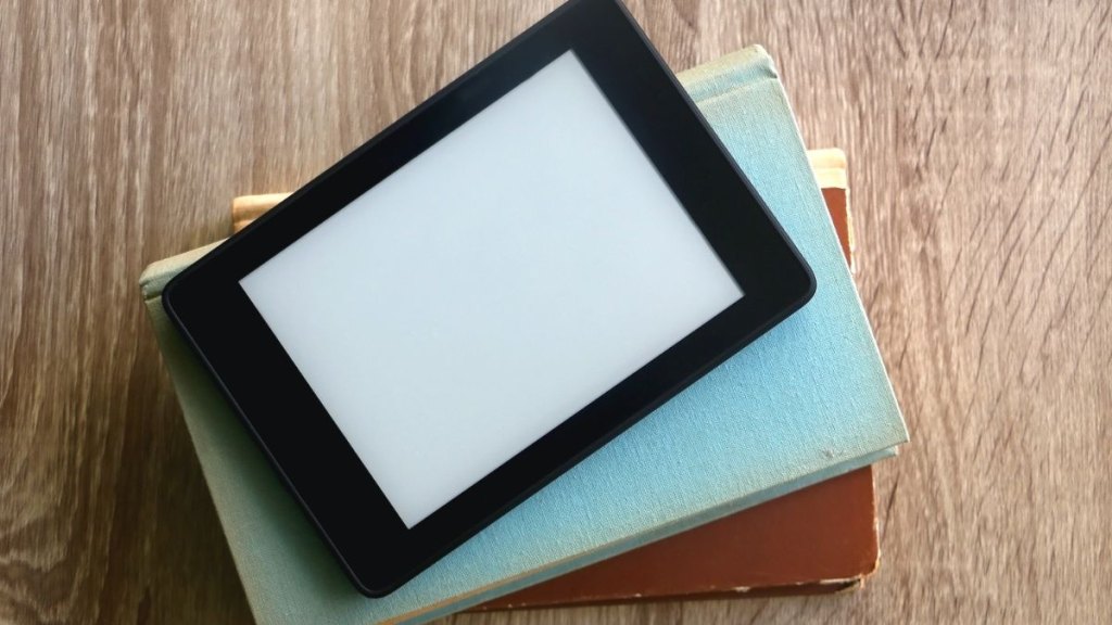 kindle on a stack of books