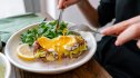 A woman eating eggs as a non-statin alternative to lowering her cholesterol