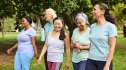 Group of women walking in park to help prevent stroke and dementia