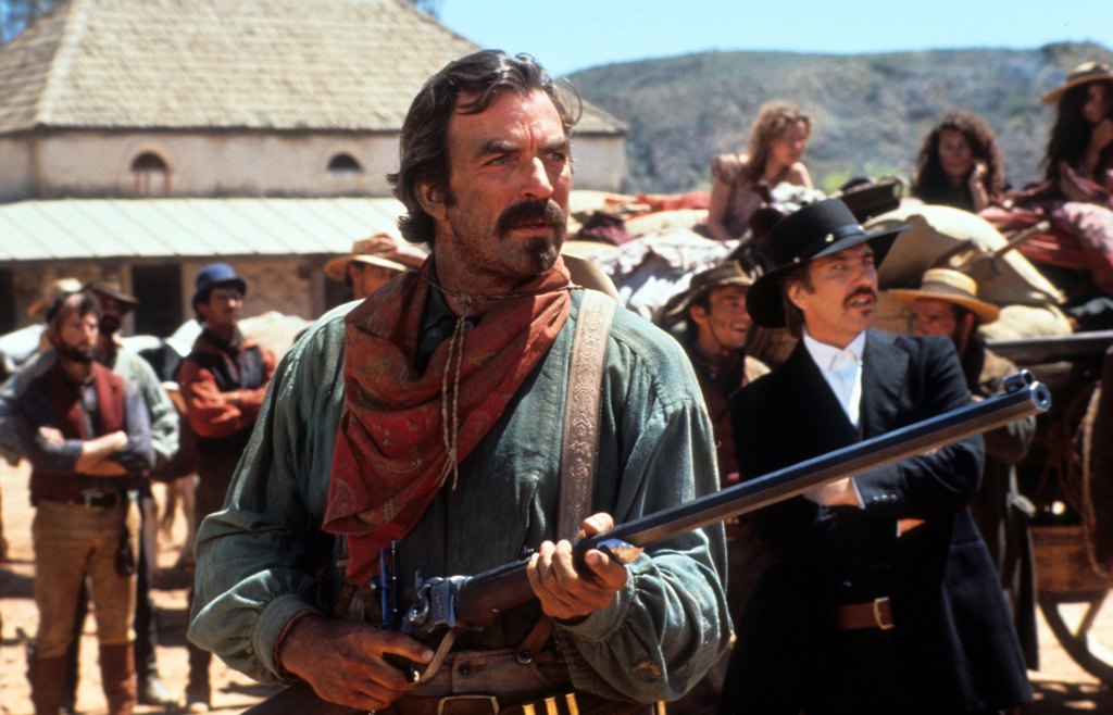 Tom Selleck holds a rifle in a scene from the film 'Quigley Down Under', 1990. (Photo by Metro-Goldwyn-Mayer/Getty Images)