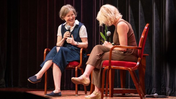 Ann Patchett laughs on stage, talking about books