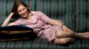 Author Ann Patchett lounges on a couch for a portrait in 2011.