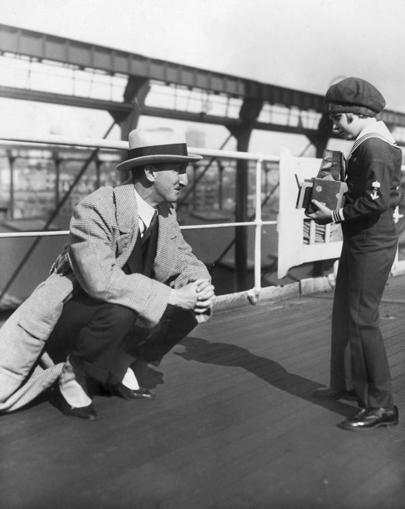 Jackie Coogan Taking A Picture Of His Father, The Actor Jack Coogan Sr., On The Ocean Liner Majestic, Between 1920 And 1922. 