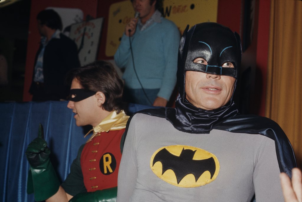 Burt Ward, in costume as 'Robin', with Adam West in costume as 'Batman', their characters in the 'Batman' television series, unspecified location, circa 1980.