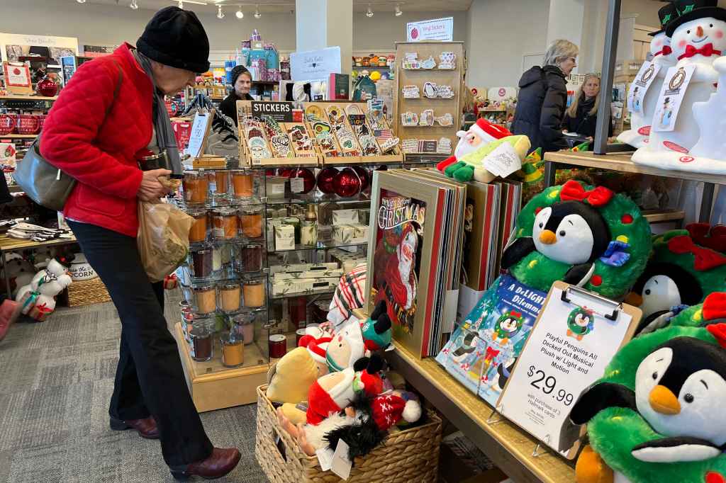 People shopping in a Hallmark store during the Christmas season