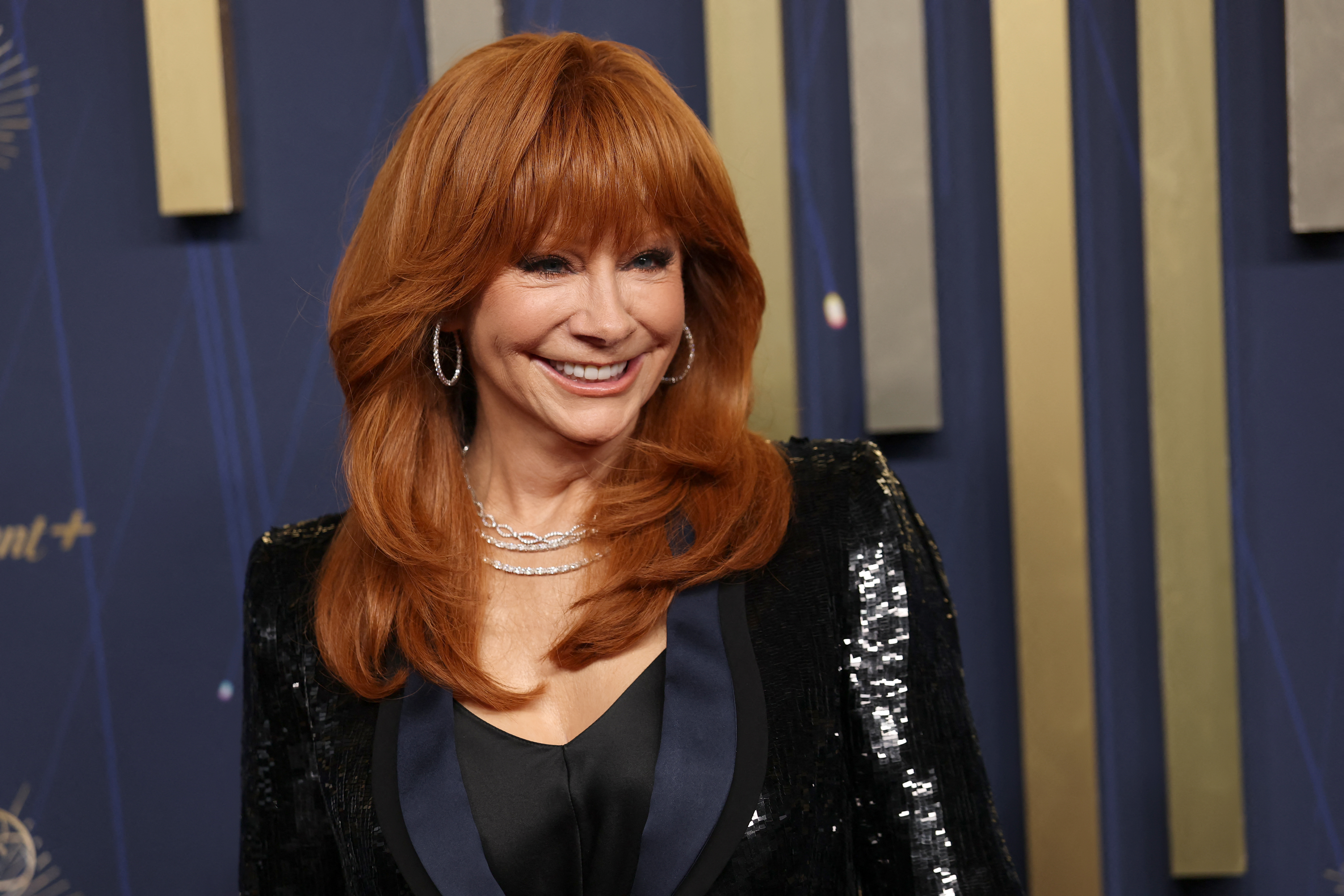 Reba McEntire, 71, Recommends 5 Must-Read Books She Couldn't Put Down—From Steamy Time Travel to Musical Memoirs!