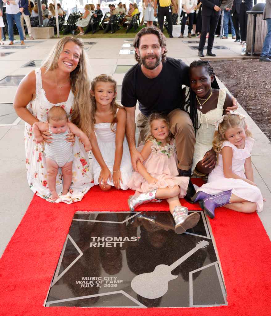 Lauren Akins and Thomas Rhett pose with their children during the Music City Walk of Fame induction ceremony for Thomas Rhett at Music City Walk of Fame