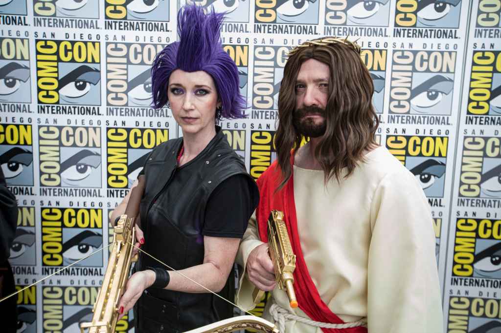 Dungeon Crawler Carl cosplayers Wendy Newton as Katia (L) and Trevor Newton as Uzi Jesus pose during Day 2 of 2026 Comic-Con International on July 24, 2026 in San Diego, California.