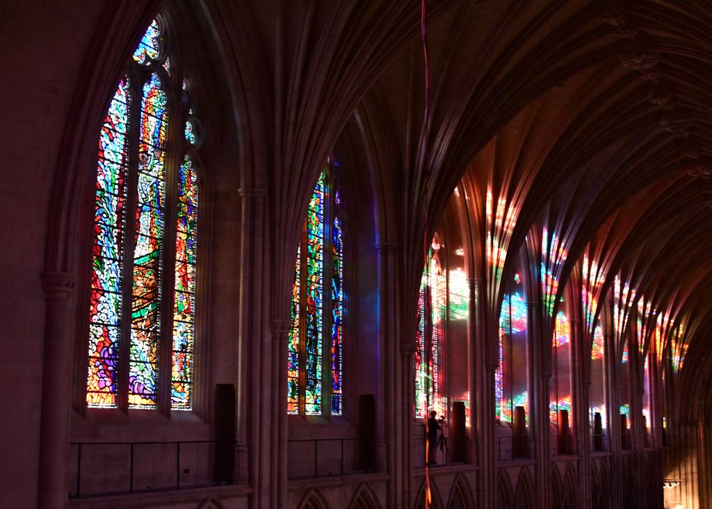 Sunlight filters through the stained glass windows inside the National Cathedral in Washington, DC June 20, 2017. - There are 215 stained glass windows in the Cathedral. 