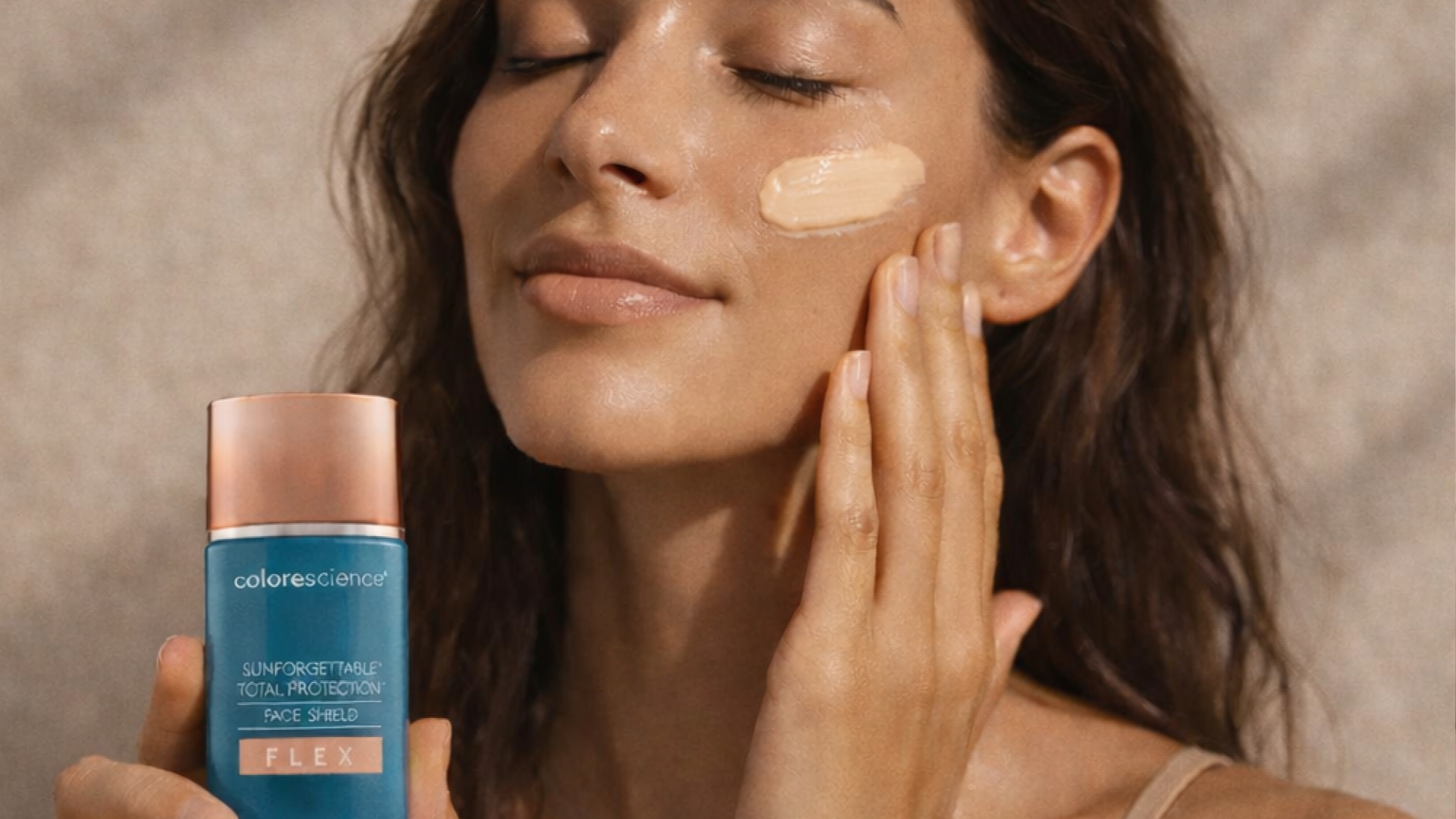 Woman applying skincare products as part of a simple morning routine.