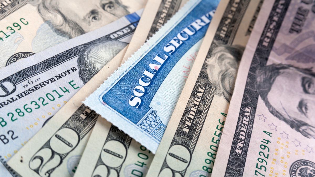 Social security card and American money dollar bills