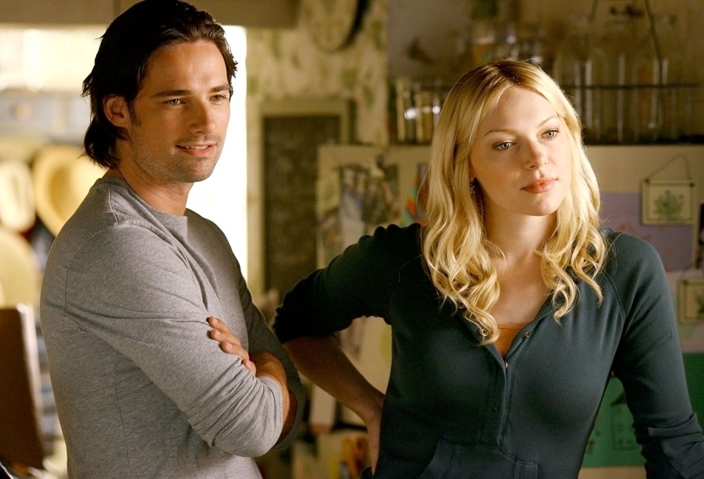 Warren Christie and Laura Prepon in 'October Road'