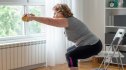A woman doing a seated chair exercise to improve her balance and coordination