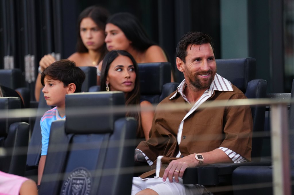 FORT LAUDERDALE, FLORIDA - AUGUST 06: Lionel Messi #10 of Inter Miami looks on from the sidelines next to wife Antonela Roccuzzo during the Leagues Cup Phase One match between Inter Miami CF and Pumas de la UNAM at Chase Stadium on August 06, 2025 in Fort Lauderdale, Florida. (Photo by Rich Storry - Leagues Cup/MLS via Getty Images)