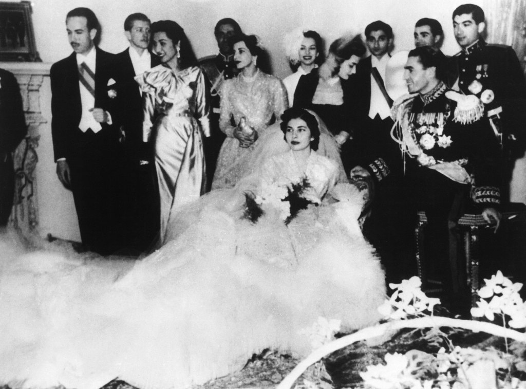 IRAN - FEBRUARY 14: Princess SORAYA ESFANDIARI (center) on her wedding with Shah Muhammad-Reza PAHLAVI of Iran in Tehran Royal Palace. From left to right : Ahmed FAHLBAD, the American writer Vincent HILLYER, his wife Princess FATIMA, the Iranian prince Ali Reza PAHLAVI, Princess CHAM, PARI-SIMA Zand, the Iranian princess Ashraf PAHLAVI, Prince Hamid Reza PAHLAVI, Abdoh Reza PAHLAVI and Prince Gholam Reza PAHLAVI. (Photo by Keystone-France/Gamma-Keystone via Getty Images)