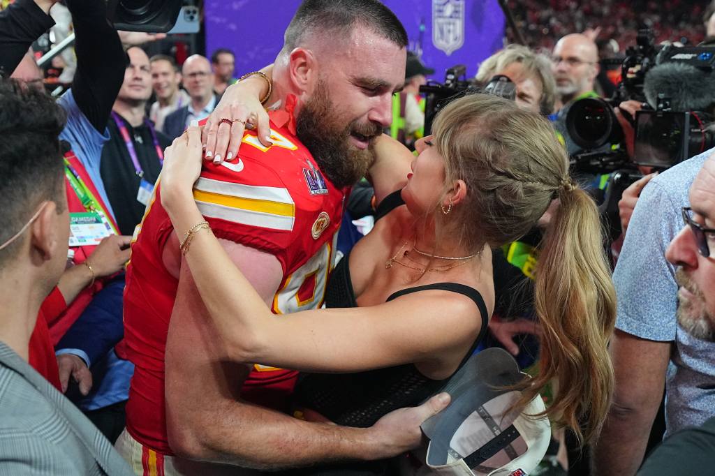 Football: Super Bowl LVIII: Kansas City Chiefs Travis Kelce (87) kisses girlfriend and singer Taylor Swift following victory vs San Francisco 49ers at Allegiant Stadium.