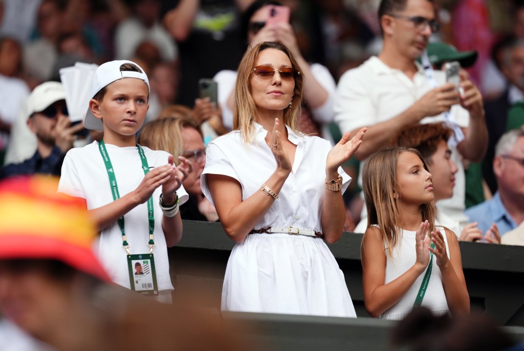 Jelena Djokovic, wife of Novak Djokovic with her son Stefan (left) and daughter Tara (right) on day one of the 2026 Wimbledon Championships at the All England Lawn Tennis and Croquet Club, London. Picture date: Monday June 29, 2026. (Photo by John Walton/PA Images via Getty Images)