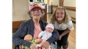 Evelyn gives baby dolls to seniors in honor of her Pappy