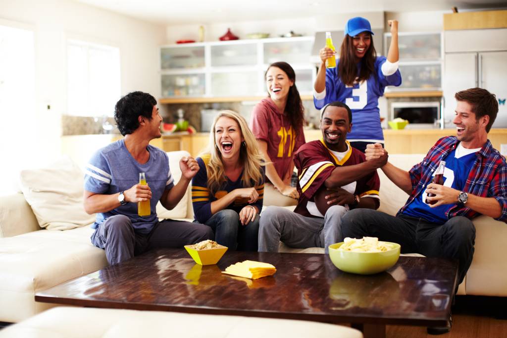 Friends watching football together