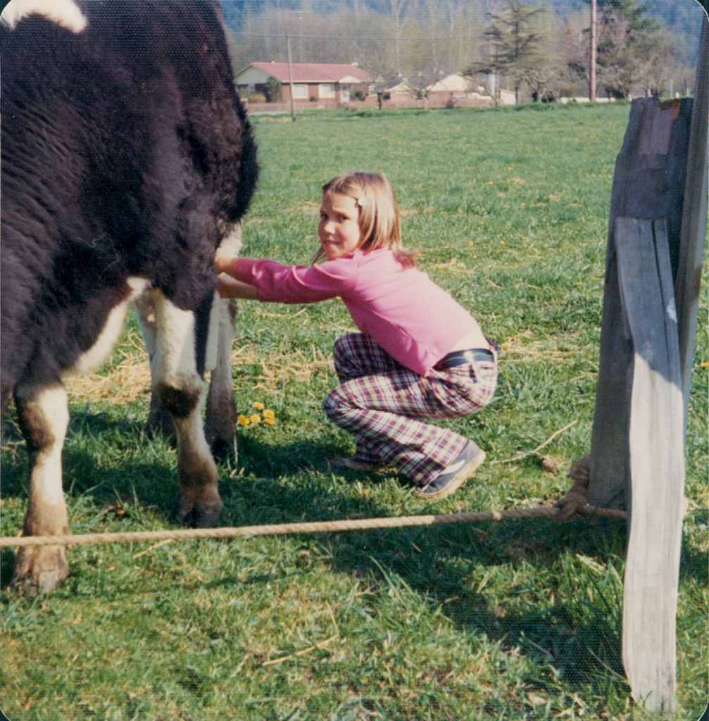Growing up on a farm, Renee has always had a passionfor livestock (Here, 8-year-old Renee milks a cow)