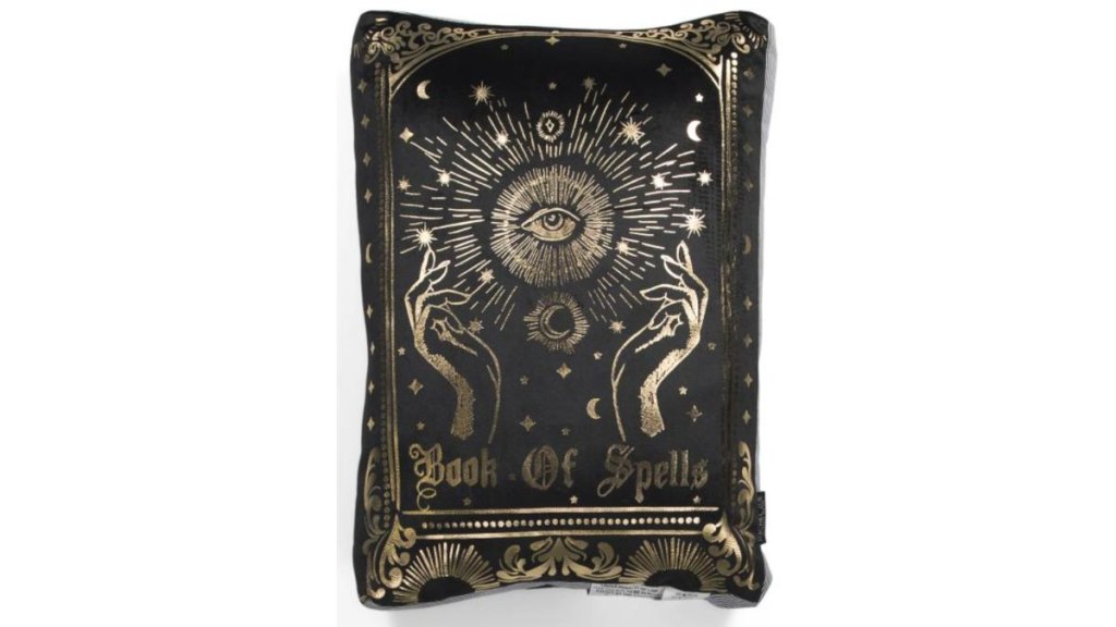 A book of spells throw pillow
