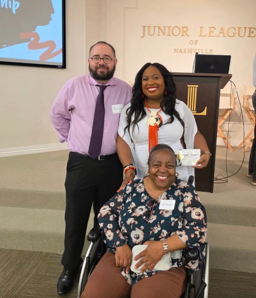 Feylyn with her husband, Thomas, and mother, Darline, with her award for Outstanding Active Member of the Junior League of Nashville