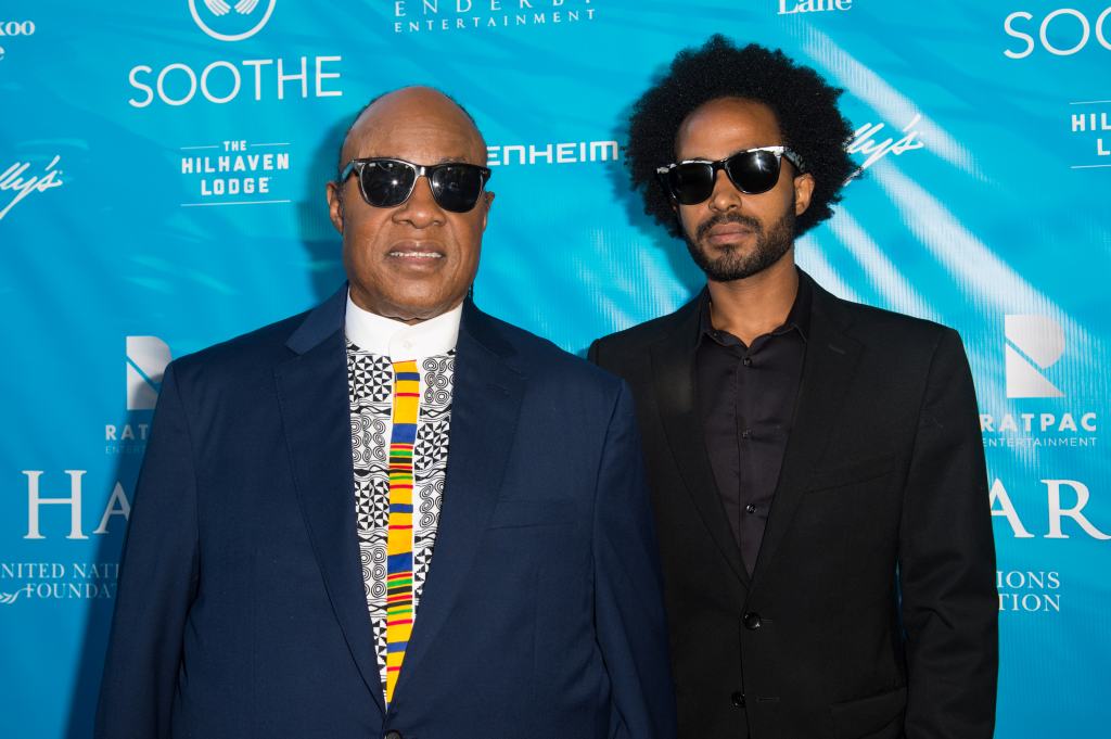 Stevie Wonder (L) and Kwame Morris attend at RatPac Entertainment Hosts Special Event for UN Secretary-General Ban Ki-moon at Hillhaven Lodge on August 10, 2016 in Los Angeles, California.