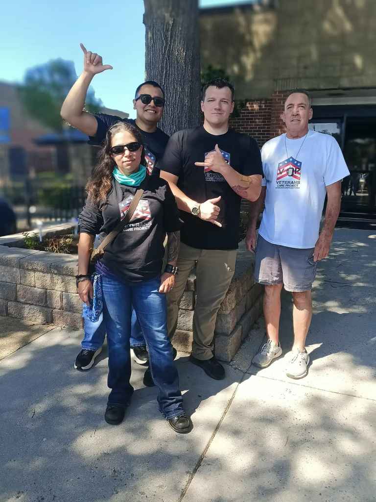 Rick and Veterans Care Project volunteers have fun while serving veterans