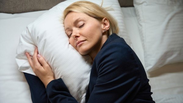 Woman sleeping soundly after using Andrew Huberman's hack