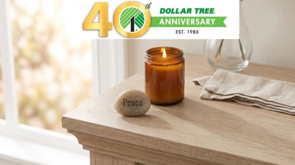 a Dollar Tree river stone printed with "peace" sitting on a nightstand beside a candle