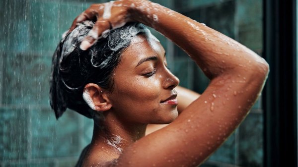A woman washing her hair during an everything shower