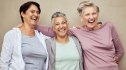 Three woman laughing and socializing to help boost their memory