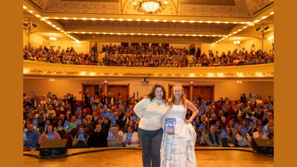 Jodi Picoult takes a crowd shot from the National Writers Series stage.