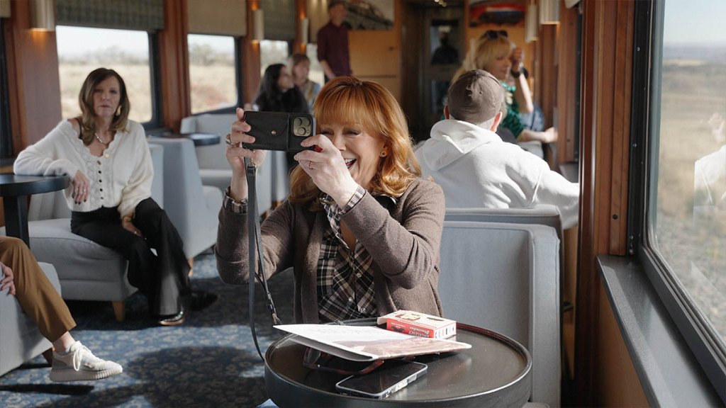 Reba snapping photos