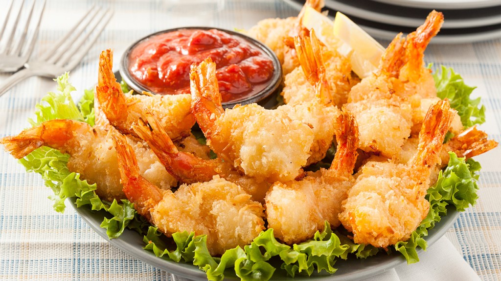 Coconut shrimp as one of the recipes for a game day snacks spread