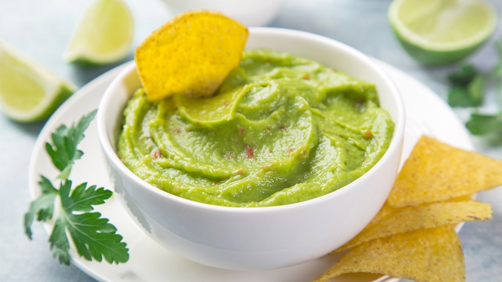 Fresh tomatillo guacamole as one of the recipes for a game day snacks spread