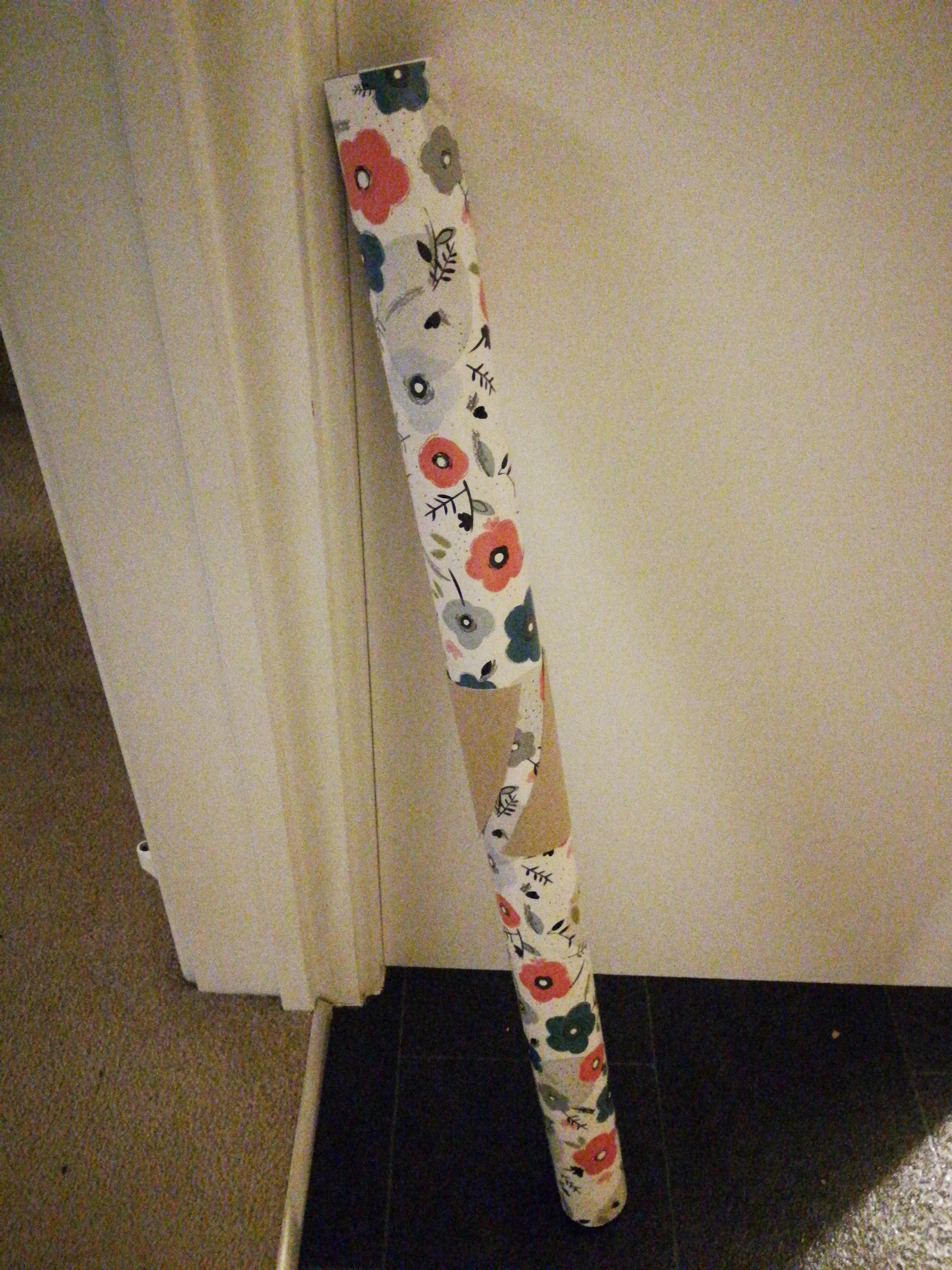 Placing an old toilet paper roll around a sheet of wrapping paper is a great way to keep things neat.