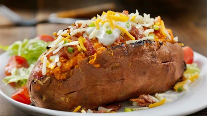 A baked sweet potato with all the fixings to help offset menopause bothers