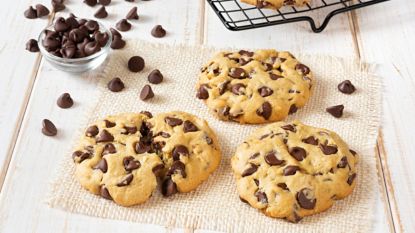 air fryer chocolate chip cookies on table with chocolate chips