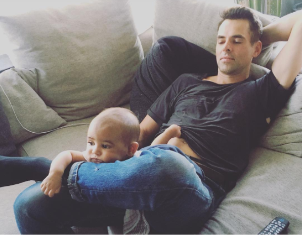 Jason Thompson and son Bowie watching TV - Instagram